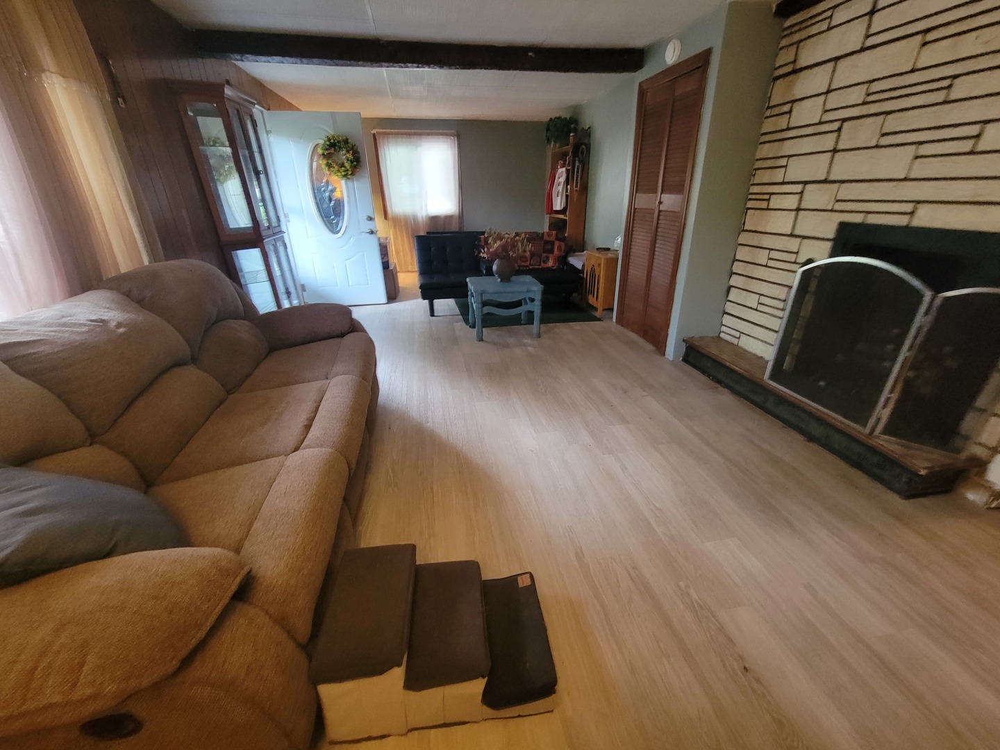 783 North 2853rd Road Utica, IL 61373 - Photo 5 of 26 a living room with furniture and a fireplace