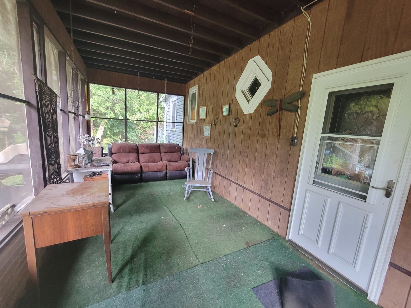783 North 2853rd Road Utica, IL 61373 - Photo 6 of 26 a view of a livingroom with furniture and a flat screen tv