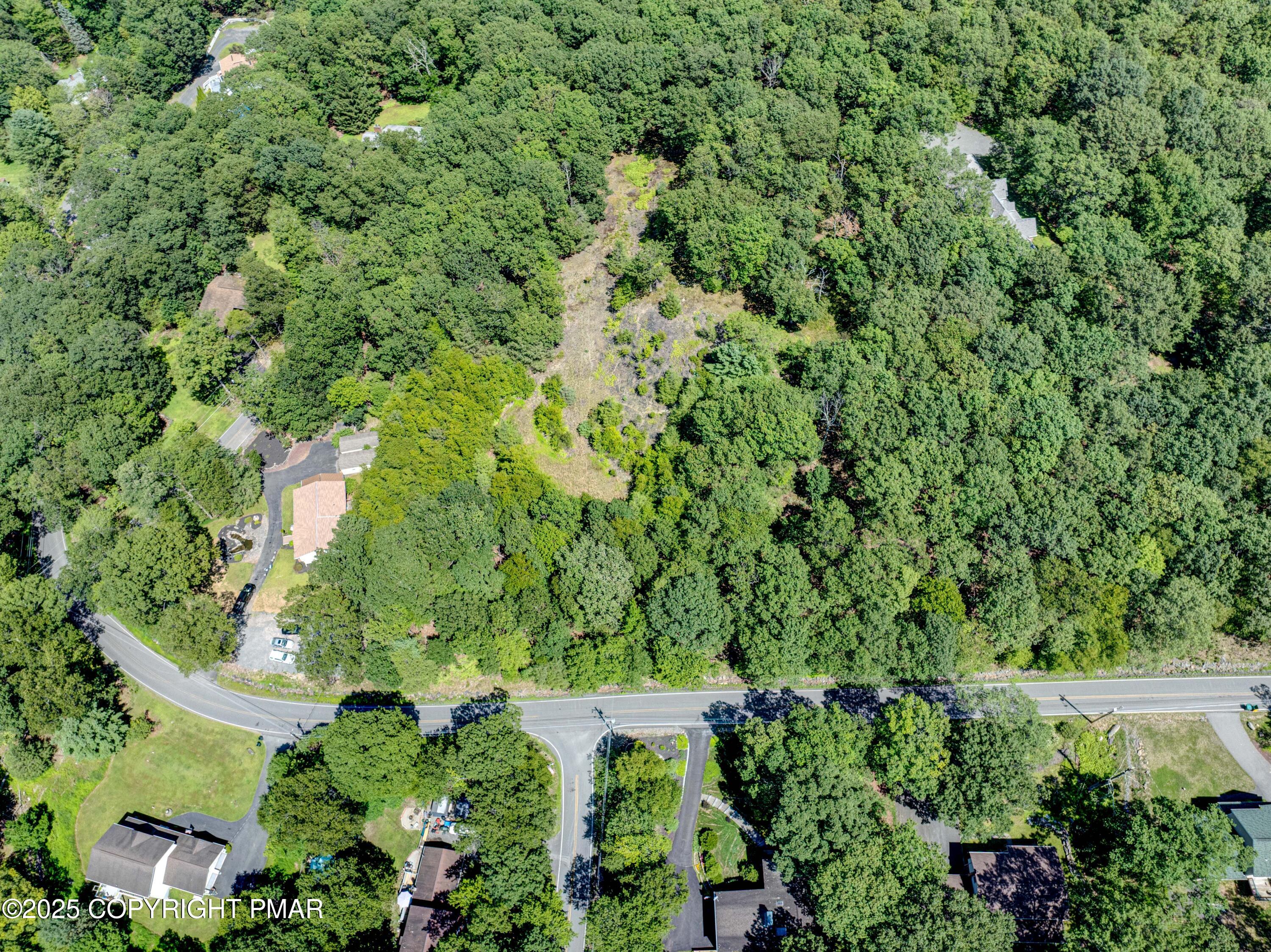 66 Laurel Loop Swiftwater, PA 18370 - Photo 4 of 7 an aerial view of a house with a yard