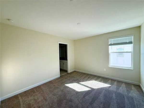 an empty room with a empty space and window