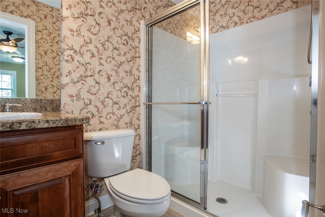 630 Rundle Street Lagrange, OH 44050 - Photo 30 of 49 Bathroom with wallpapered walls, vanity, and a shower stall