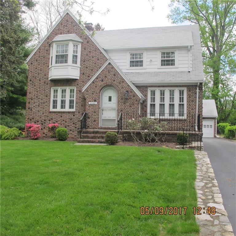2068 Stratfield Road Fairfield, CT 06825 - Photo 1 of 1 a front view of a house with a garden