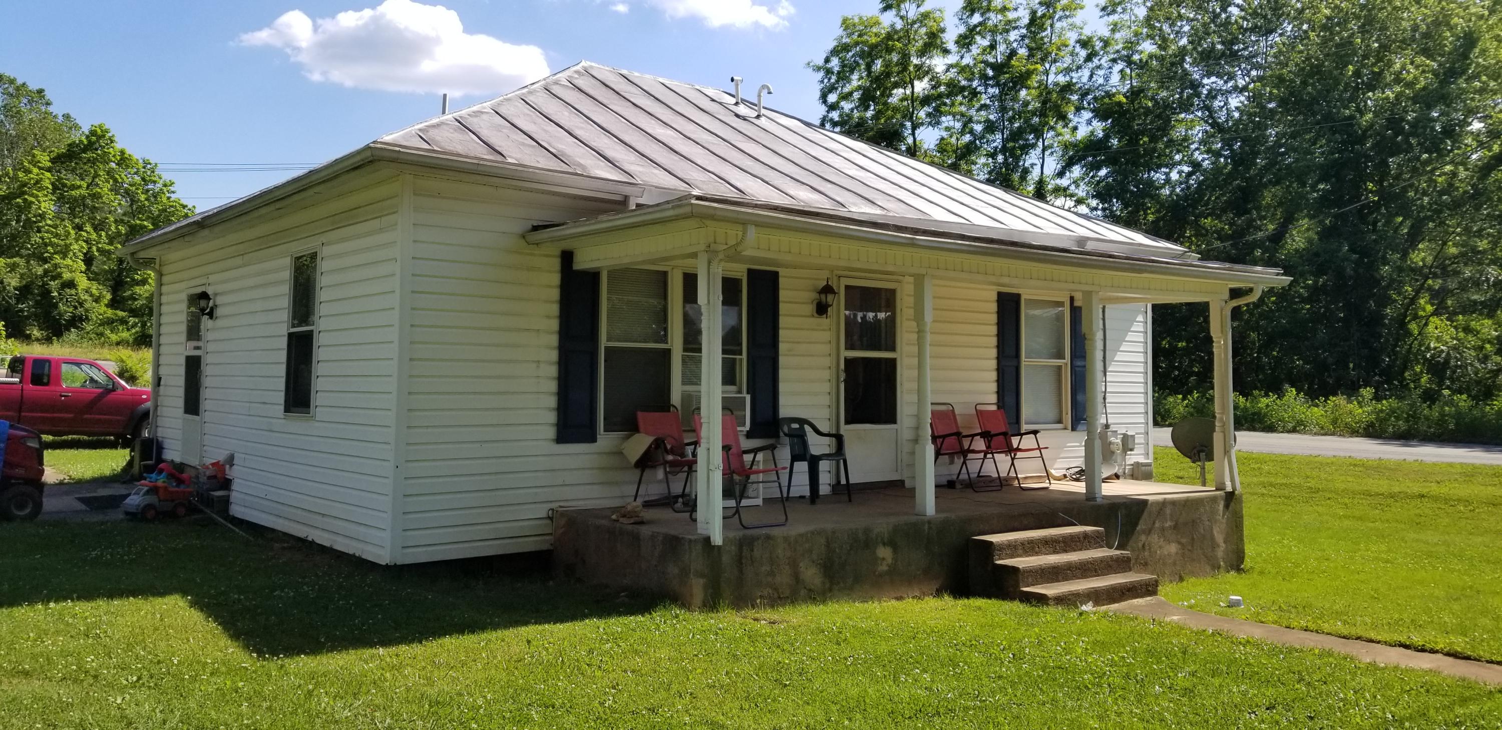 24 Woodcott Road, Unit 26 Ferrum, VA 24088 - Photo 7 of 12 a view of a house with backyard porch and sitting area