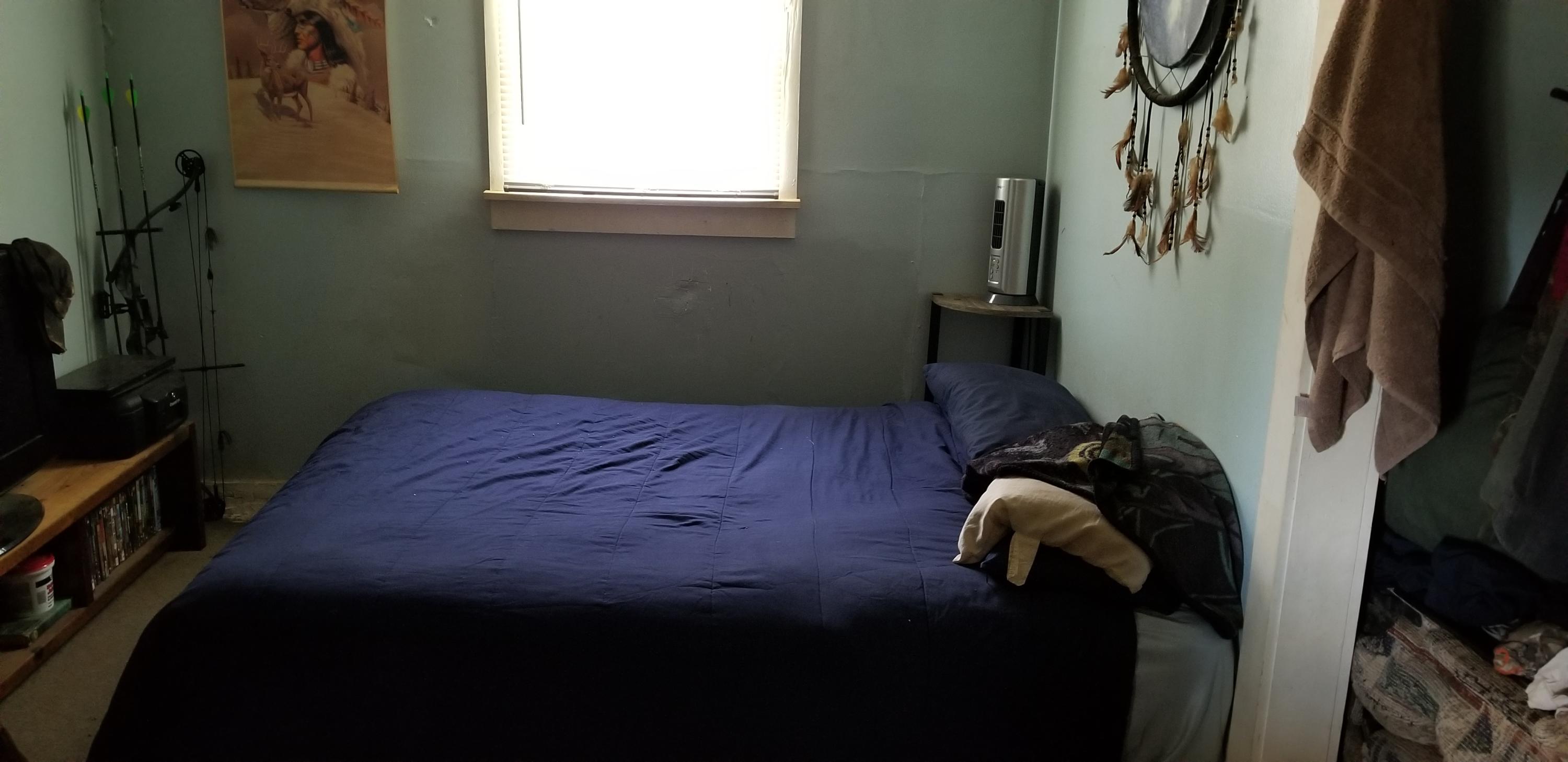 24 Woodcott Road, Unit 26 Ferrum, VA 24088 - Photo 10 of 12 a bed sitting in a bedroom next to a window