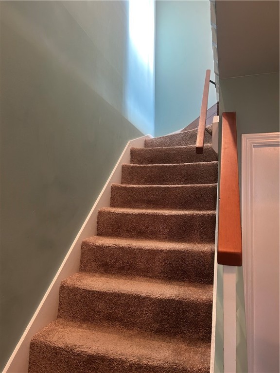 1002 Ocean Boulevard, Unit 1002 St. Simons Island, GA 31522 - Photo 3 of 25 Staircase from Foyer to Second Level
