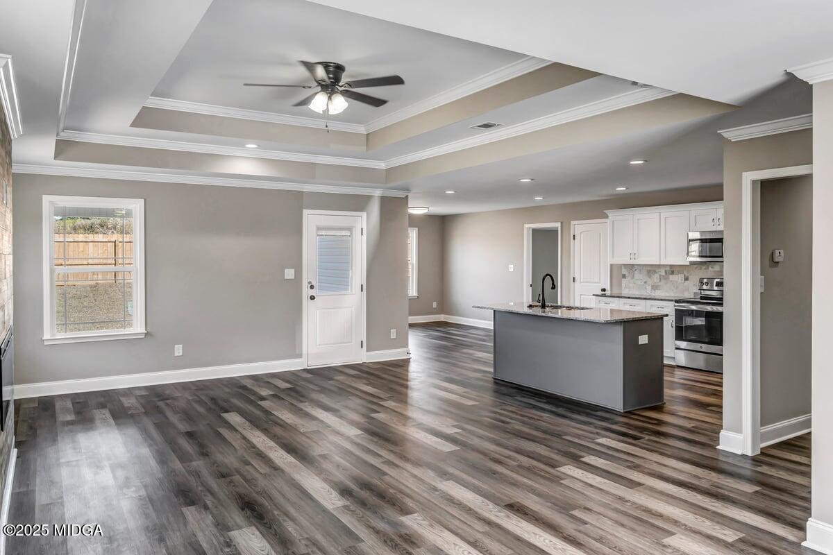 204 Eric Court Byron, GA 31008 - Photo 3 of 10 a view of kitchen with wooden floor and window