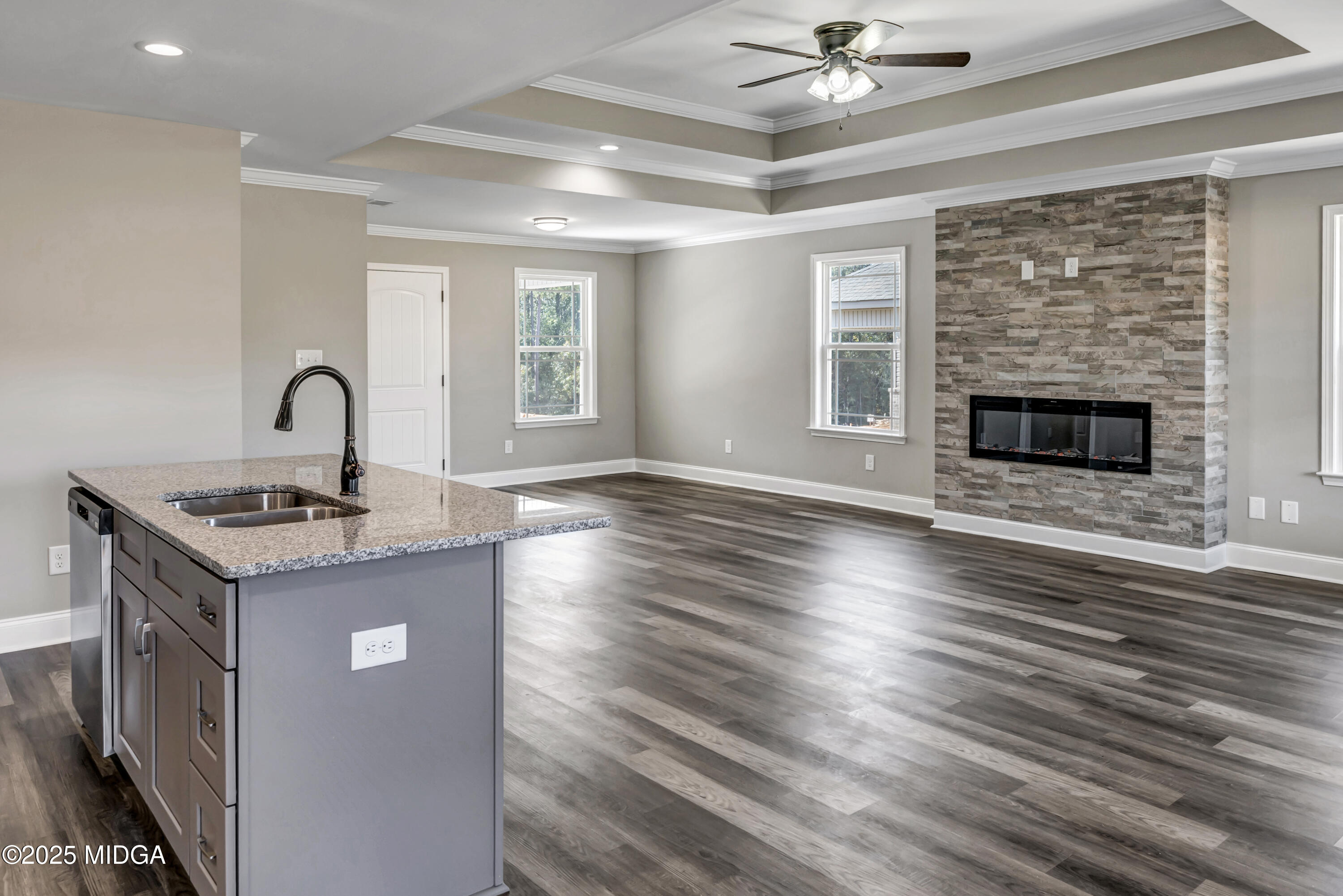 204 Eric Court Byron, GA 31008 - Photo 4 of 10 a kitchen with granite countertop a sink cabinets and wooden floor