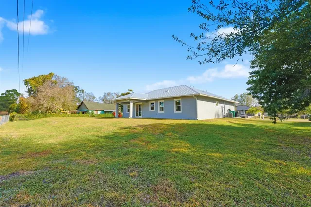 a view of a house with a big yard