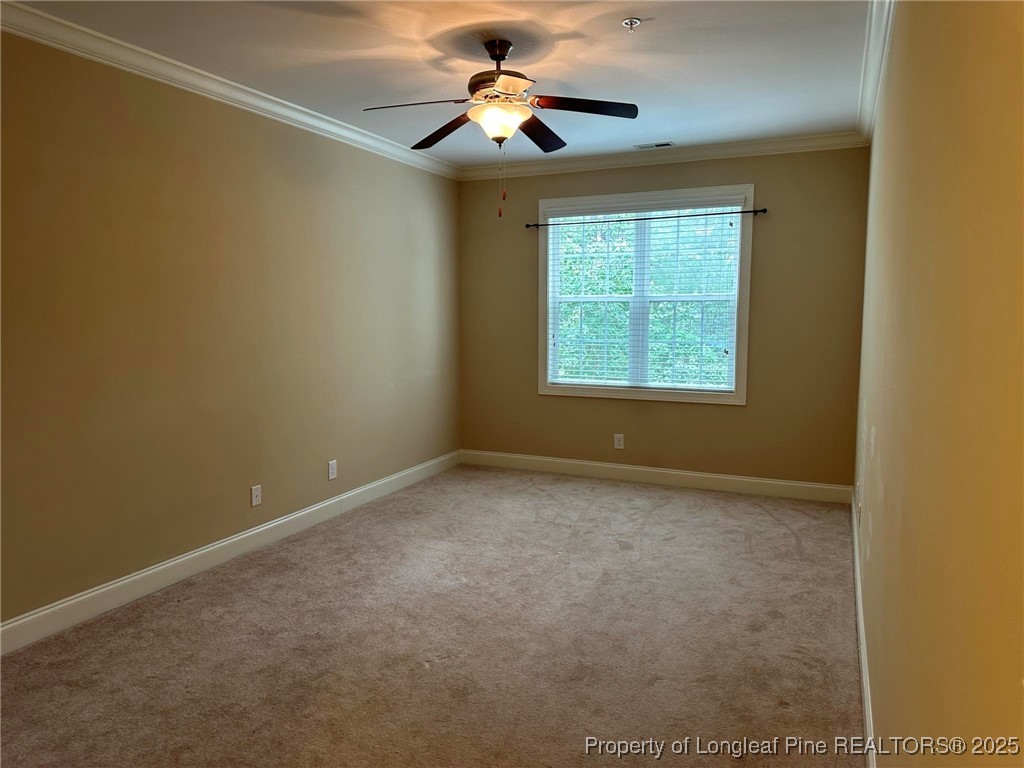 158 Gallery Drive, Unit 202 Spring Lake, NC 28390 - Photo 11 of 22 a view of a room with a ceiling fan and a window