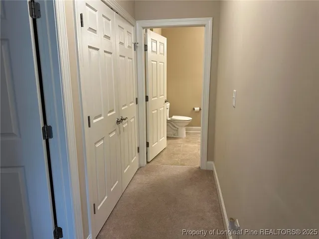 a view of a bathroom from a hallway