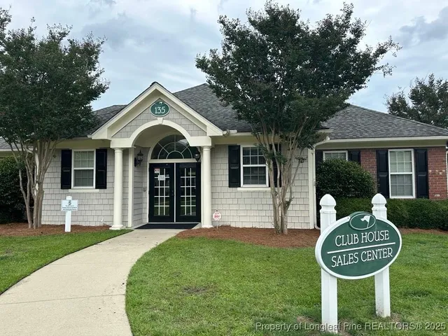 a view of a patio with table and chairs and potted plants