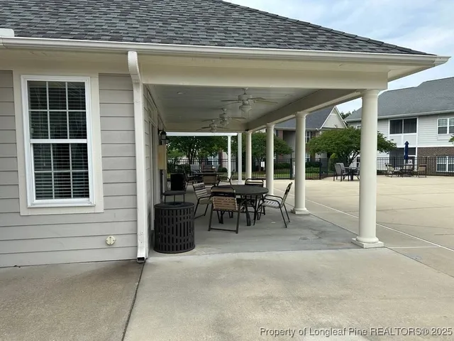 a view of a swimming pool and lounge chair