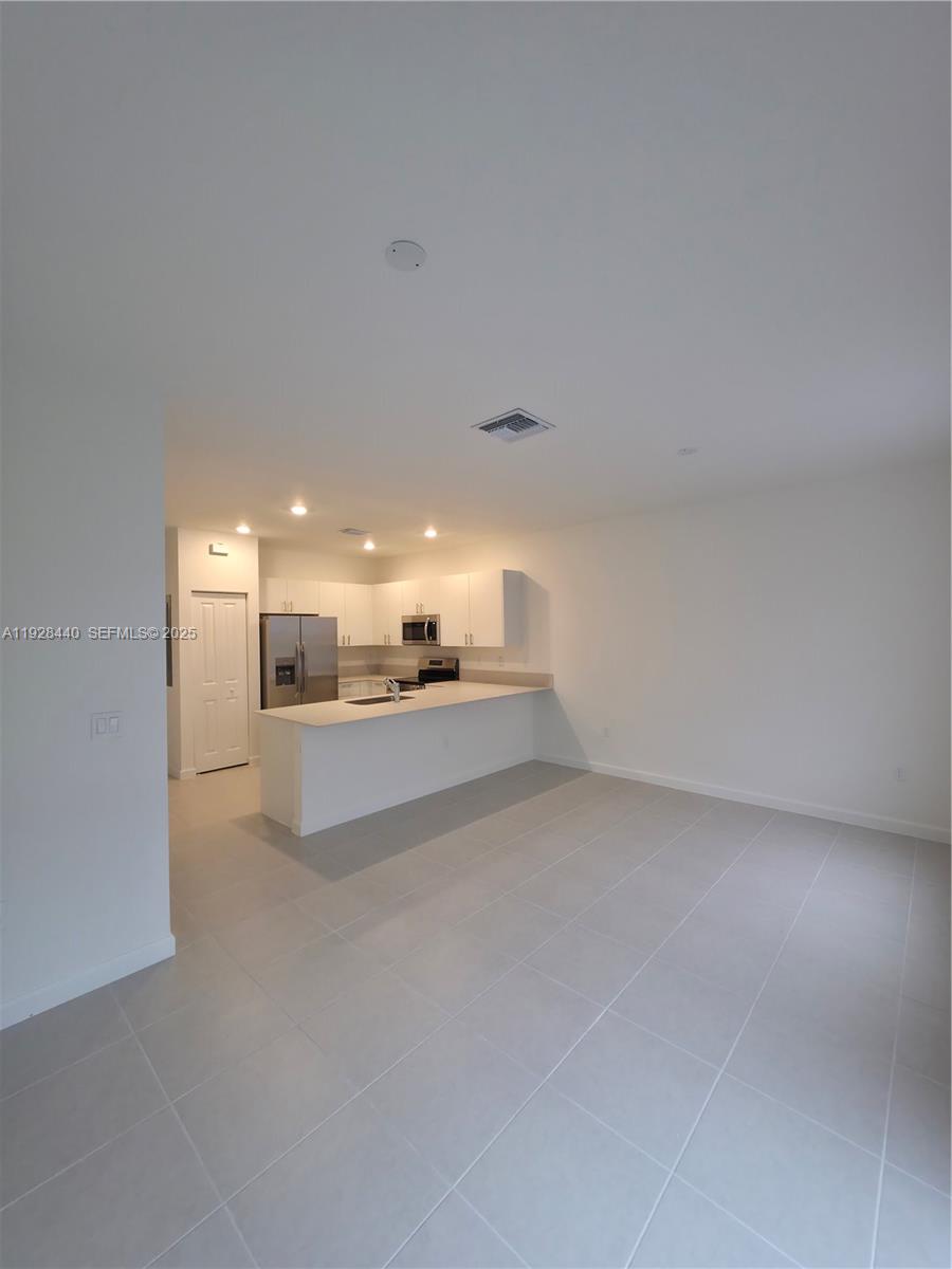 35687 Southwest 178th Court Homestead, FL 33034 - Photo 11 of 28 a view of a room with an empty space and window