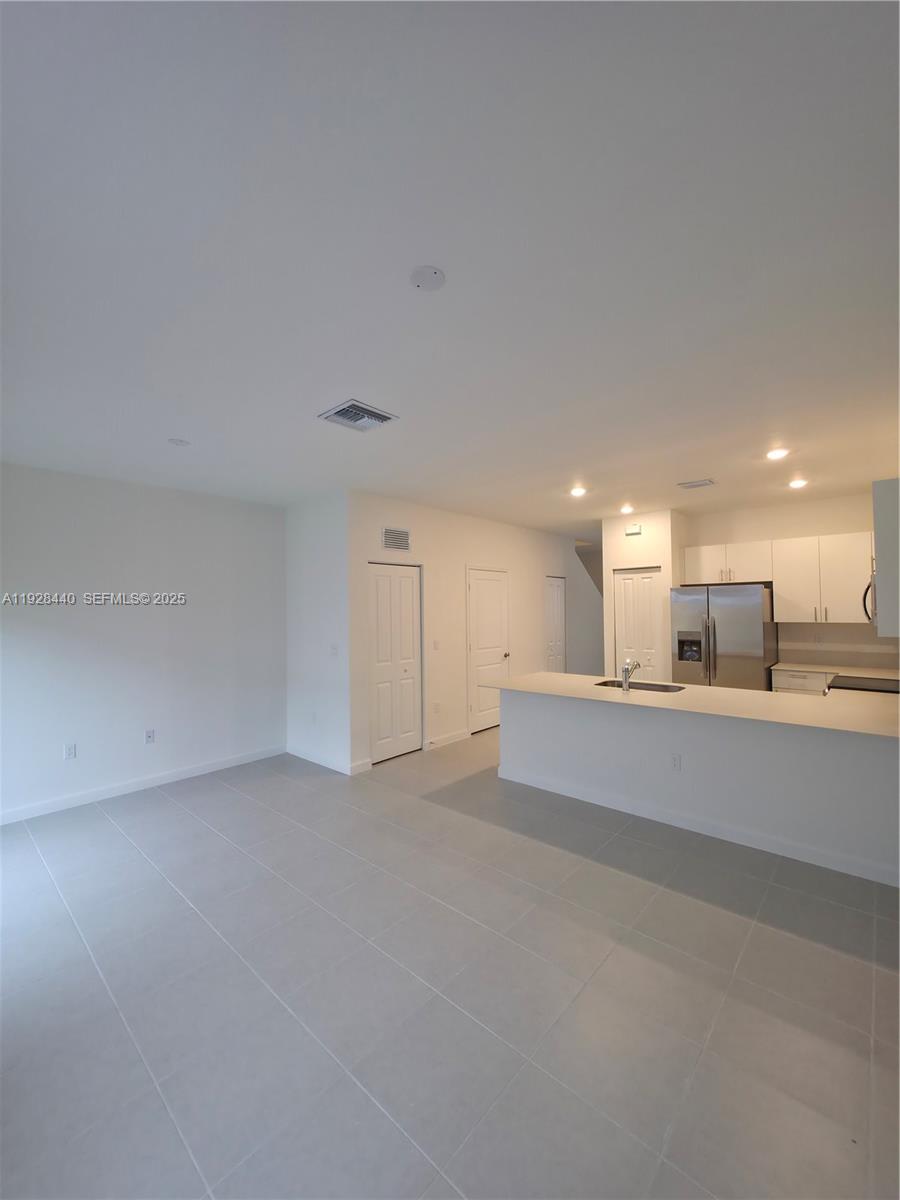 35687 Southwest 178th Court Homestead, FL 33034 - Photo 12 of 28 a view of an empty room with kitchen view