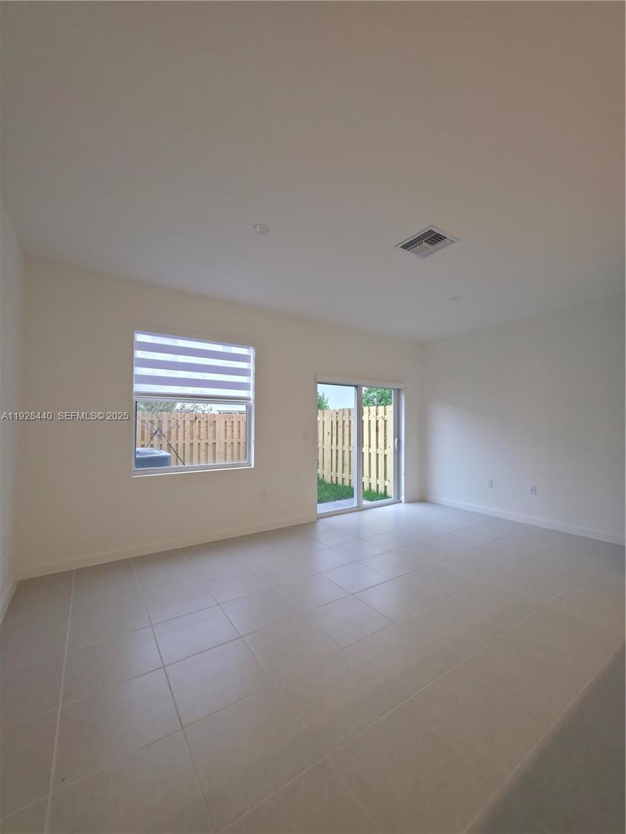 35687 Southwest 178th Court Homestead, FL 33034 - Photo 13 of 28 a view of an empty room and a window