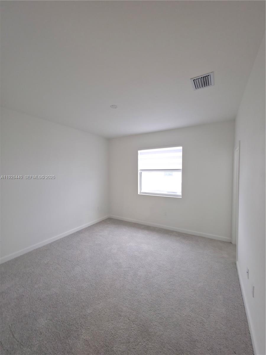 35687 Southwest 178th Court Homestead, FL 33034 - Photo 19 of 28 an empty room with a window