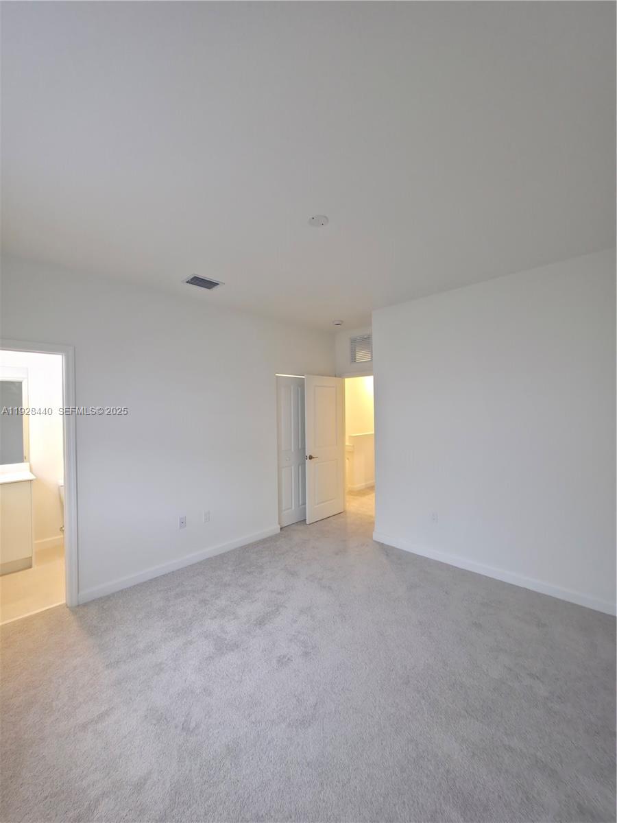 35687 Southwest 178th Court Homestead, FL 33034 - Photo 20 of 28 a view of an empty room and a window