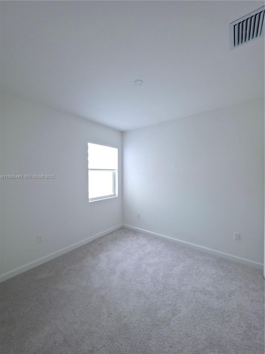 35687 Southwest 178th Court Homestead, FL 33034 - Photo 23 of 28 a view of an empty room and a window