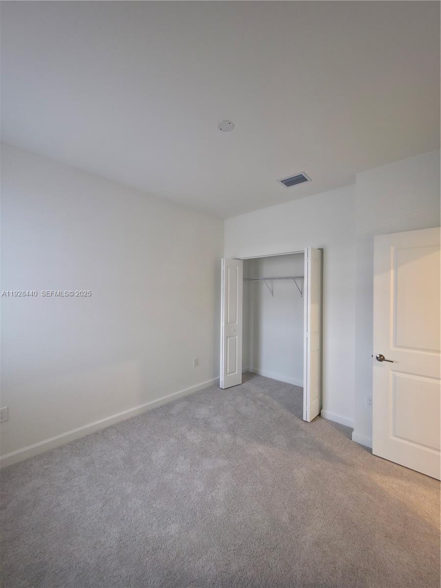 35687 Southwest 178th Court Homestead, FL 33034 - Photo 24 of 28 a view of an empty room and closet area