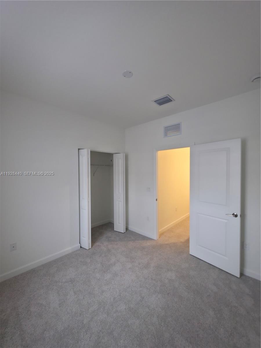 35687 Southwest 178th Court Homestead, FL 33034 - Photo 26 of 28 a view of an empty room and a window