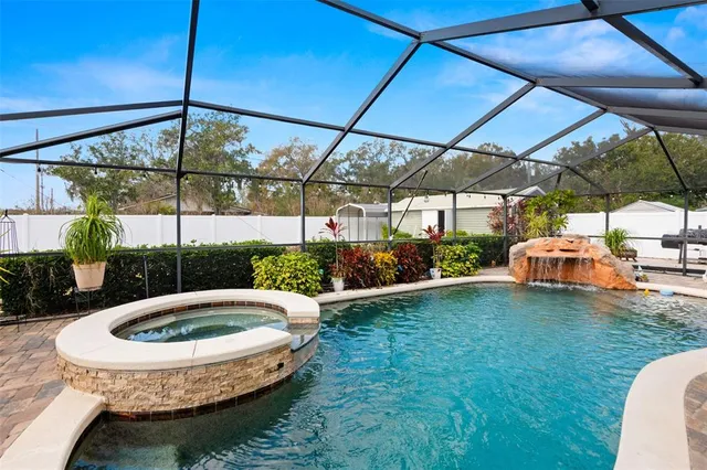 a view of a swimming pool with a patio