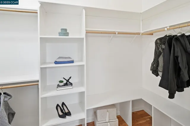 a view of a livingroom with furniture a ceiling fan and window