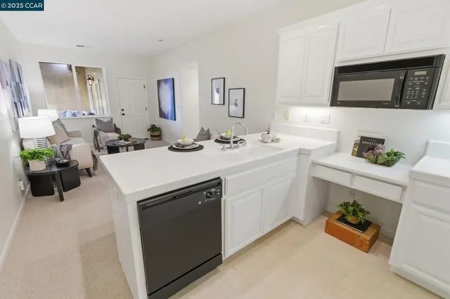 a bathroom with a sink vanity mirror and toilet
