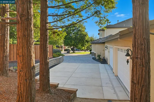 a view of a house with a yard and sitting area