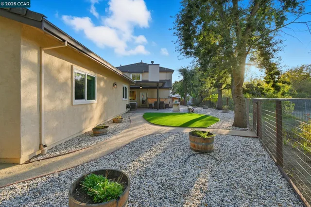 a view of a backyard with large trees