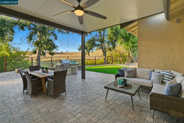 a view of a house with a swimming pool and a yard