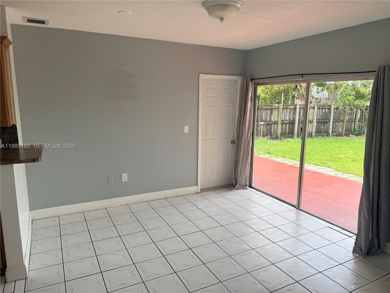 26468 Southwest 123rd Place Homestead, FL 33032 - Photo 11 of 33 a view of an empty room and window
