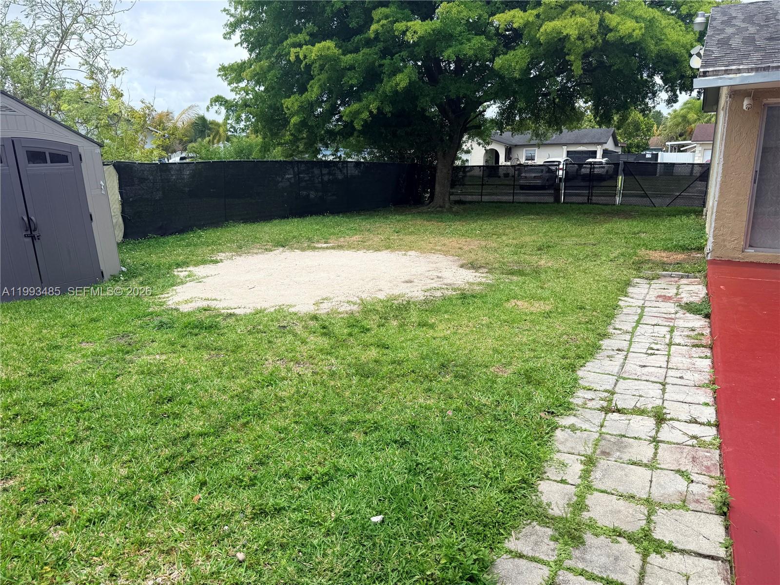 26468 Southwest 123rd Place Homestead, FL 33032 - Photo 28 of 33 a view of a backyard with sitting area