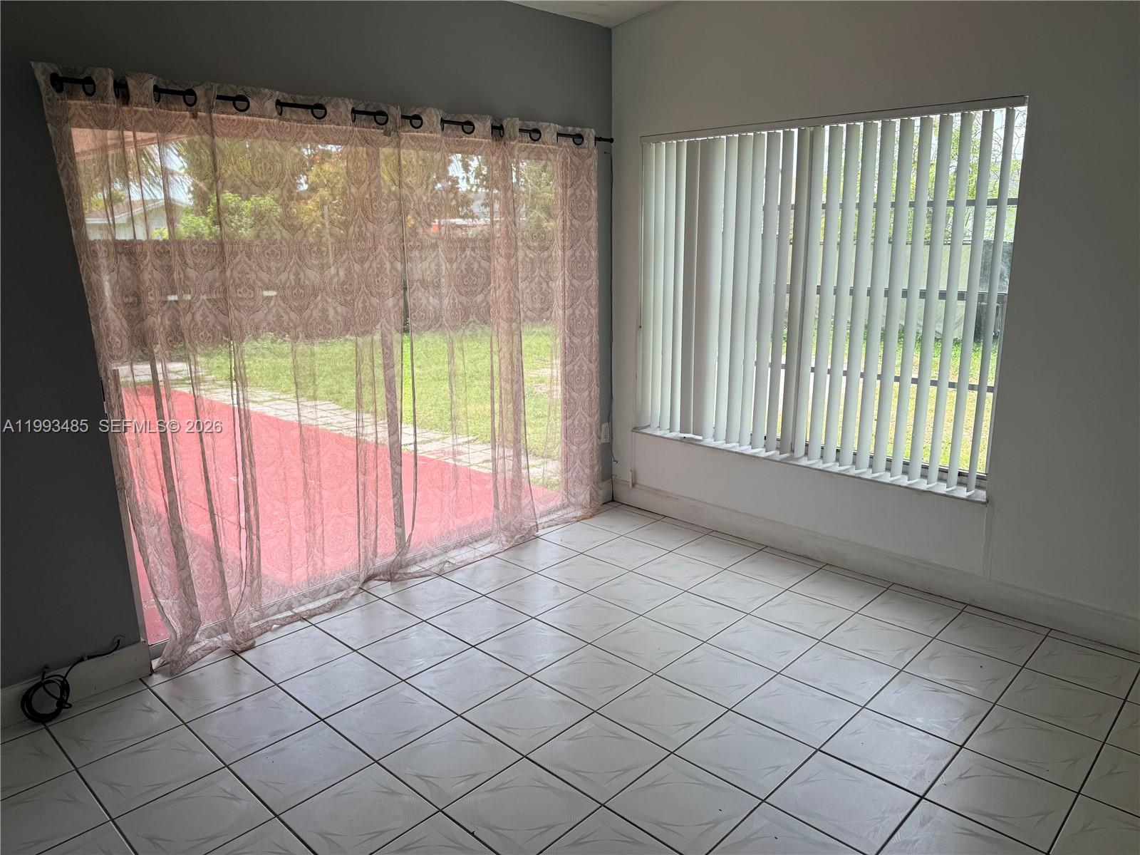 26468 Southwest 123rd Place Homestead, FL 33032 - Photo 8 of 33 a view of an empty room and window