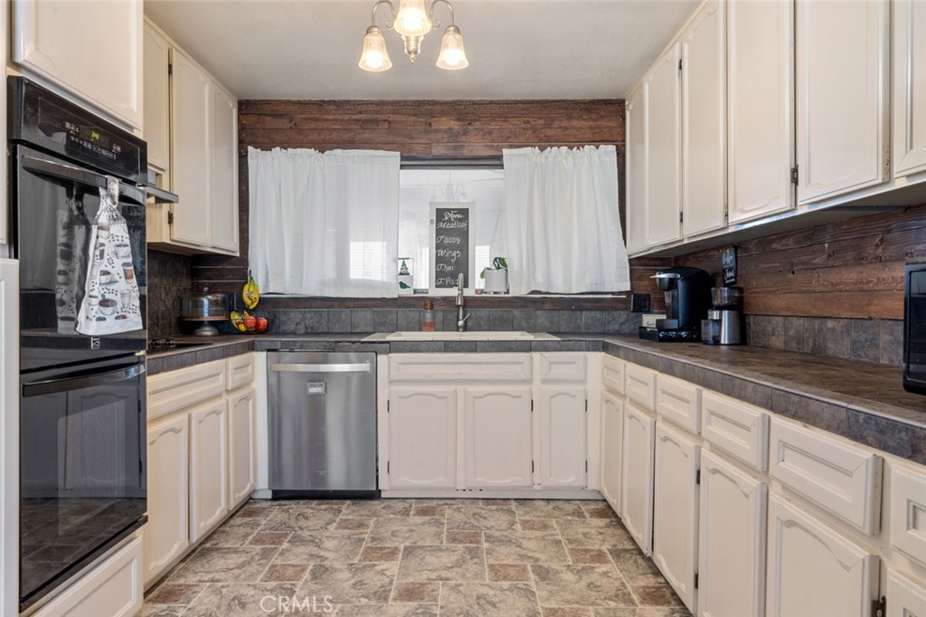 9068 Montero Road Valley Springs, CA 95252 - Photo 15 of 50 a kitchen with stainless steel appliances granite countertop a sink and cabinets