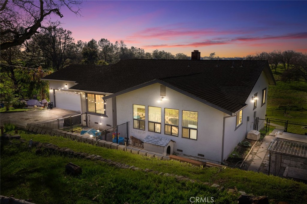 9068 Montero Road Valley Springs, CA 95252 - Photo 2 of 50 a backyard of a house with lots of green space