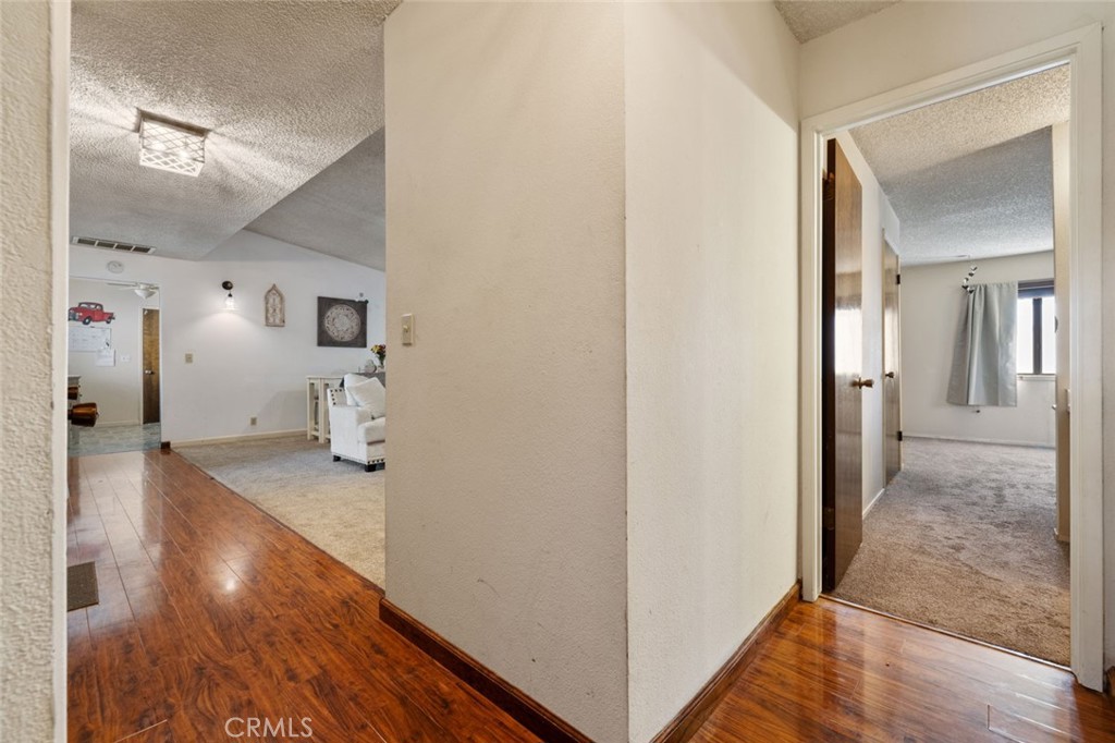 9068 Montero Road Valley Springs, CA 95252 - Photo 25 of 50 a view of a hallway view with wooden floor and living room