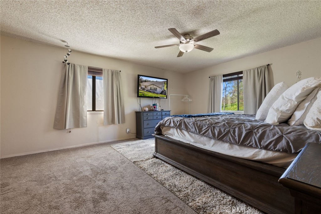 9068 Montero Road Valley Springs, CA 95252 - Photo 27 of 50 a bed sitting in a bedroom next to a window
