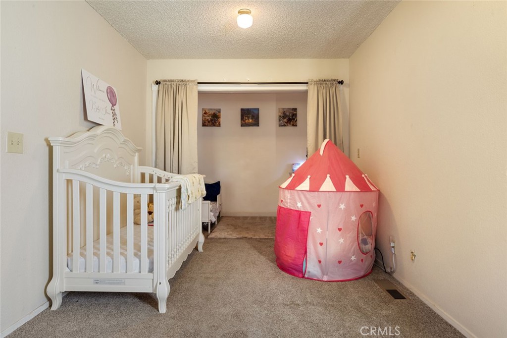 9068 Montero Road Valley Springs, CA 95252 - Photo 30 of 50 a view of a hallway with a window