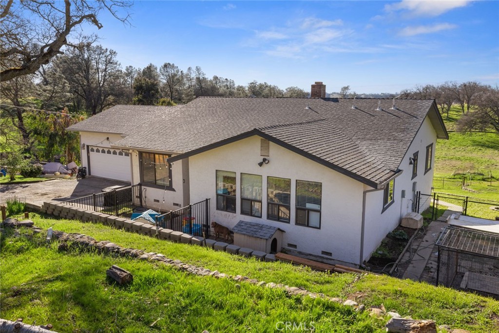 9068 Montero Road Valley Springs, CA 95252 - Photo 3 of 50 a aerial view of a house with a garden and plants