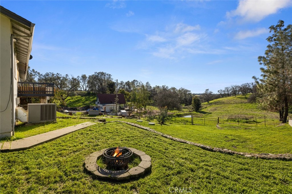 9068 Montero Road Valley Springs, CA 95252 - Photo 36 of 50 a view of a swimming pool with a yard