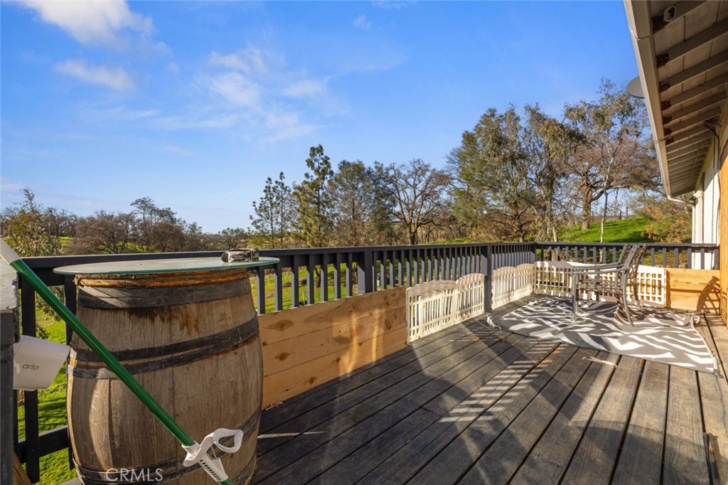 9068 Montero Road Valley Springs, CA 95252 - Photo 37 of 50 a view of balcony with wooden floor and fence
