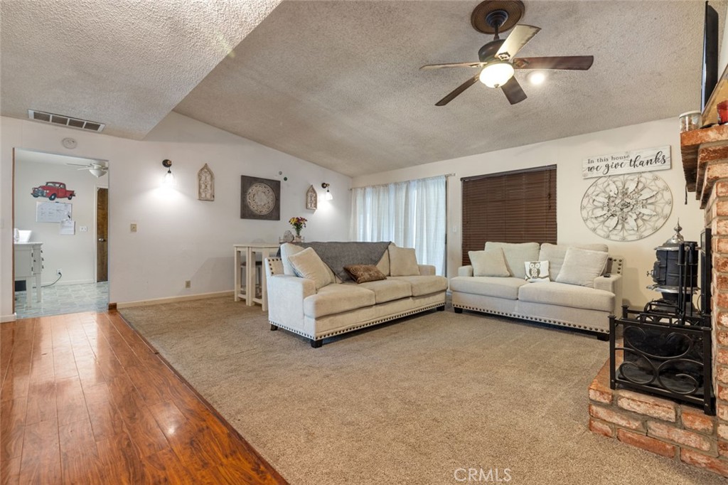9068 Montero Road Valley Springs, CA 95252 - Photo 5 of 50 a living room with furniture and a flat screen tv