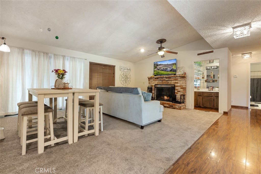 9068 Montero Road Valley Springs, CA 95252 - Photo 6 of 50 a living room with furniture and a fireplace
