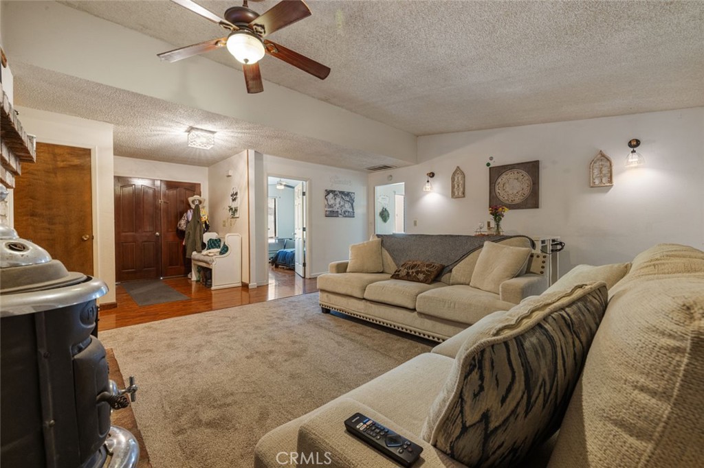 9068 Montero Road Valley Springs, CA 95252 - Photo 8 of 50 a living room with furniture and a chandelier