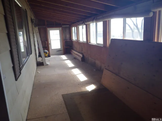 a backyard of apartments with large trees