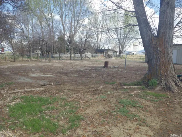 a view of an empty room with windows