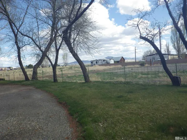 a view of outdoor space with deck and trees