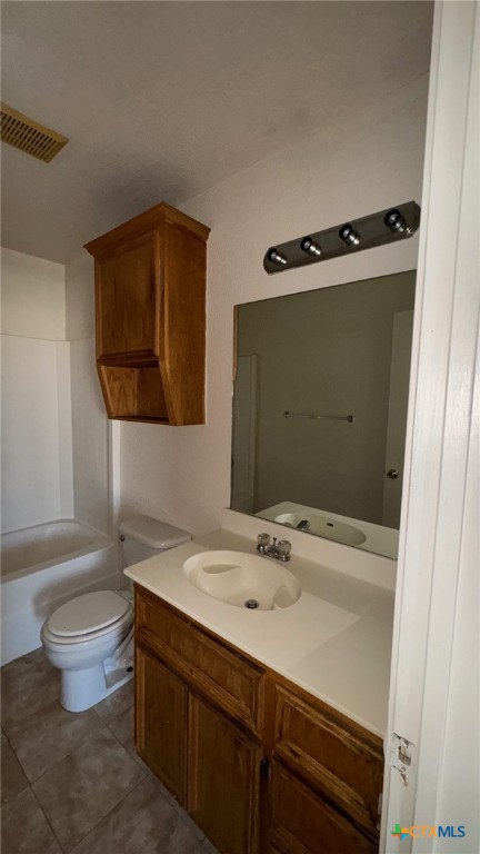 3312 Cantabrian Drive, Unit C Killeen, TX 76542 - Photo 18 of 21 a bathroom with a sink a toilet and mirror