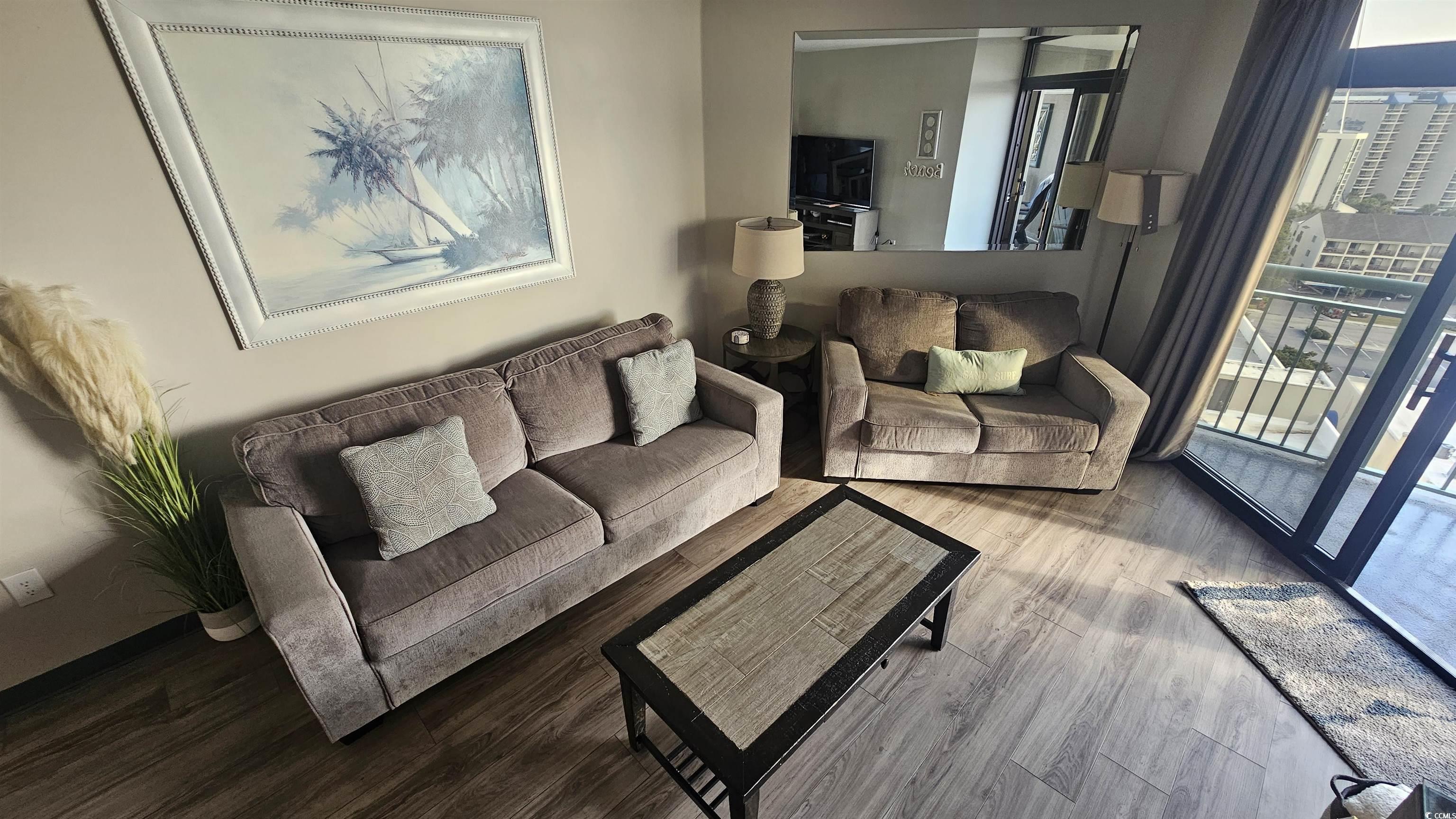 201 74th Avenue North, Unit 1201 Myrtle Beach, SC 29572 - Photo 17 of 40 Living area featuring wood finished floors