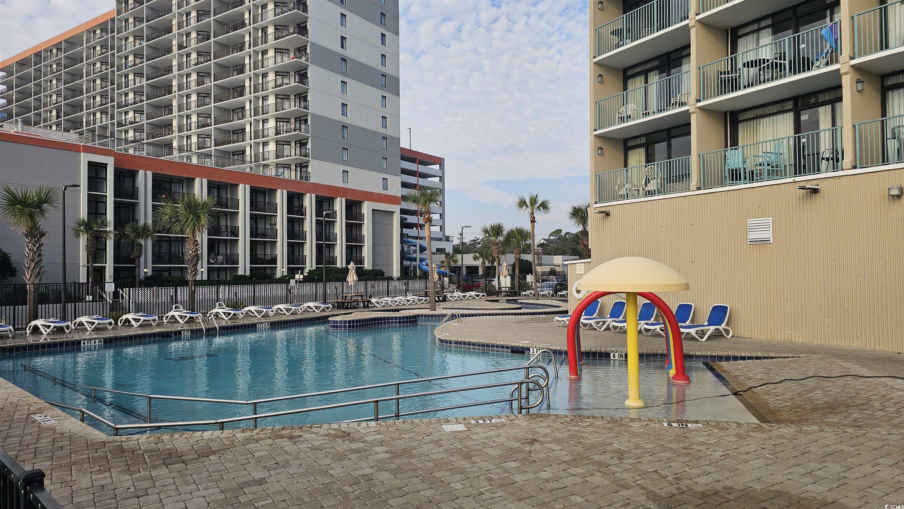 201 74th Avenue North, Unit 1201 Myrtle Beach, SC 29572 - Photo 31 of 40 Community pool featuring a patio area